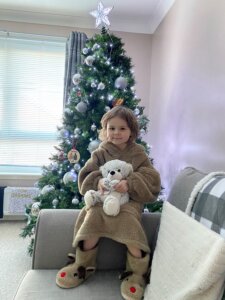 Heidi loves her cuddly bear and says a big thank you to everyone who donated to send bears to children with cancer, like her 