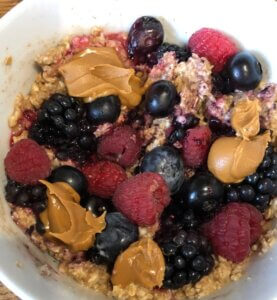 Berries and Biscoff spread mixed with porridge