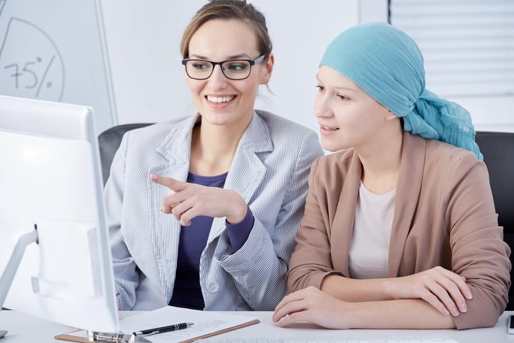 Female cancer patient with work colleague