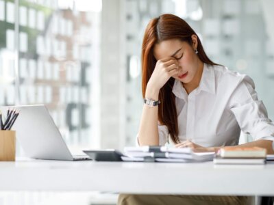 Young woman feeling ill at work