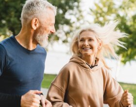 Active senior man and woman training