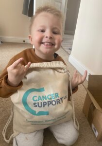 Little boy with his cancer kit