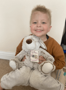 Little boy cuddling his bunny