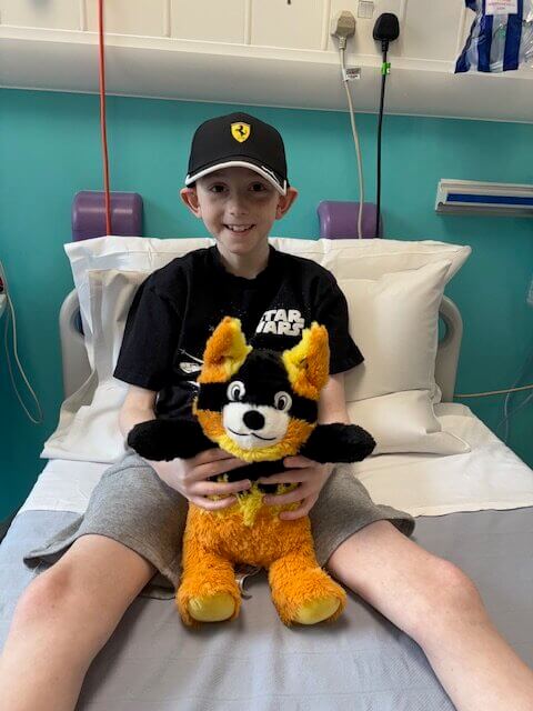Boy holding soft toy