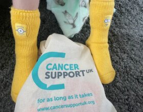 Yellow Minion socks are part of Cancer Support UK's Kids' Cancer Kit