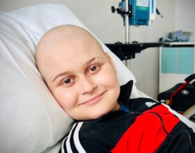 Boy with cancer in a hospital bed